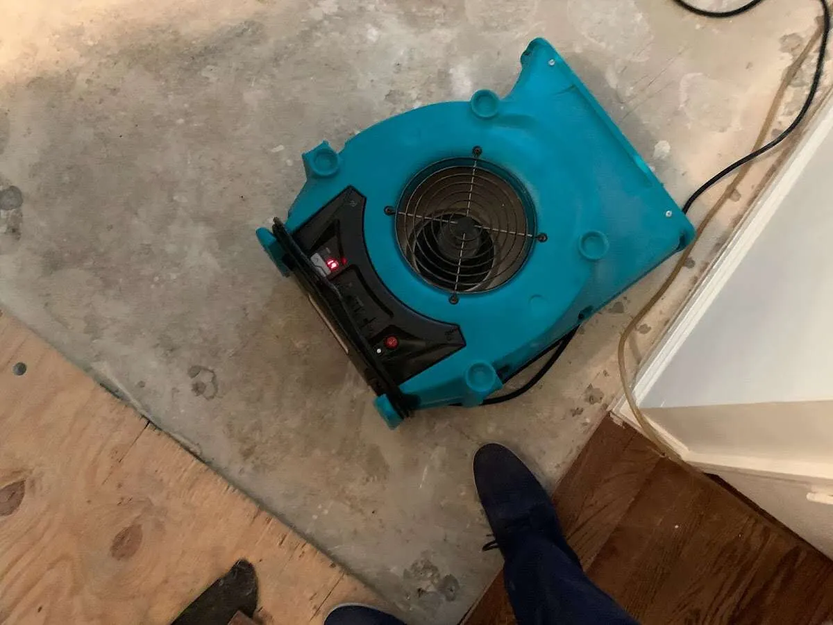 Air mover drying subfloor during Leak Detection & Repair in Mount Hood Villages